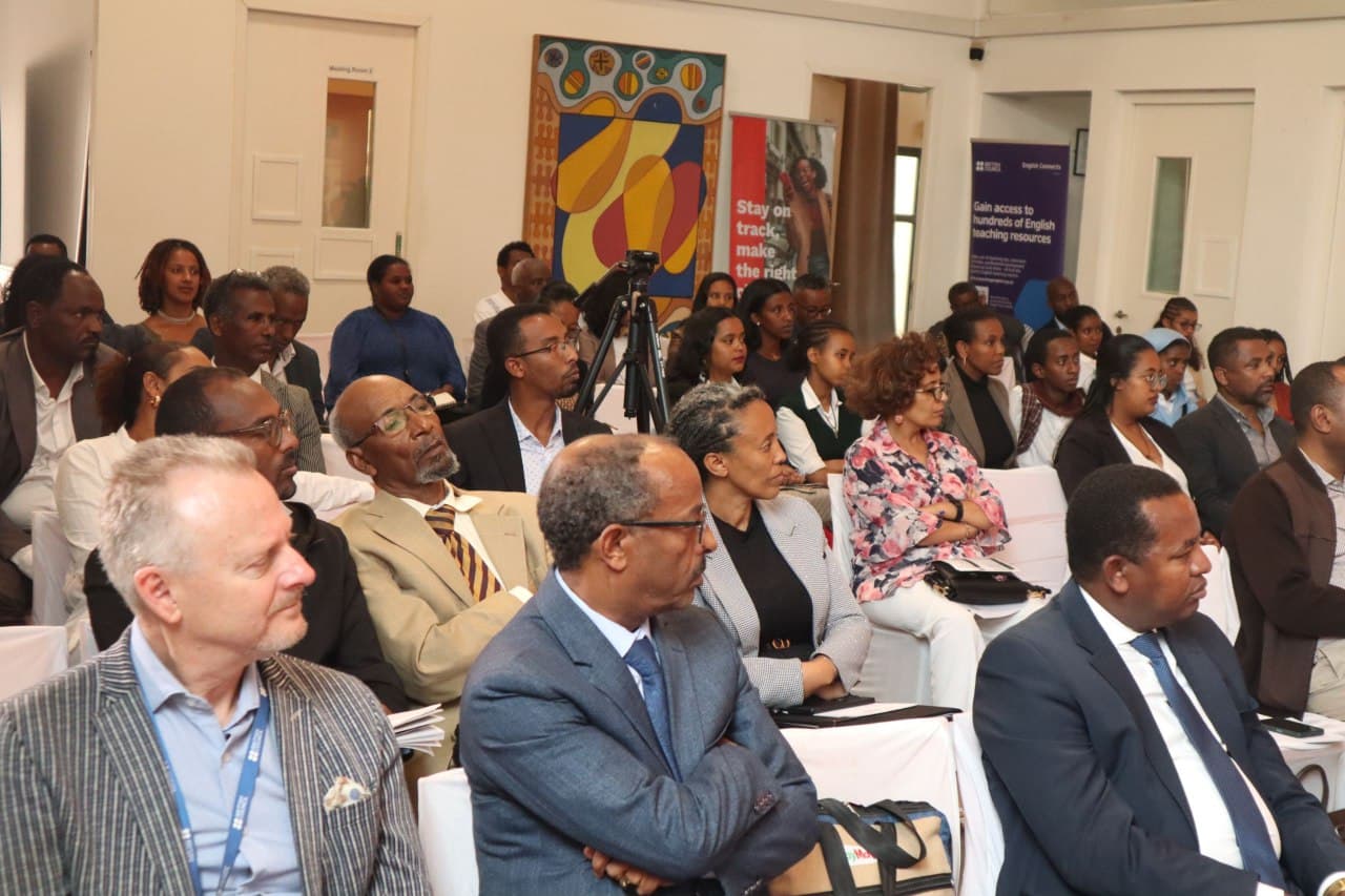Audience members following the discussion