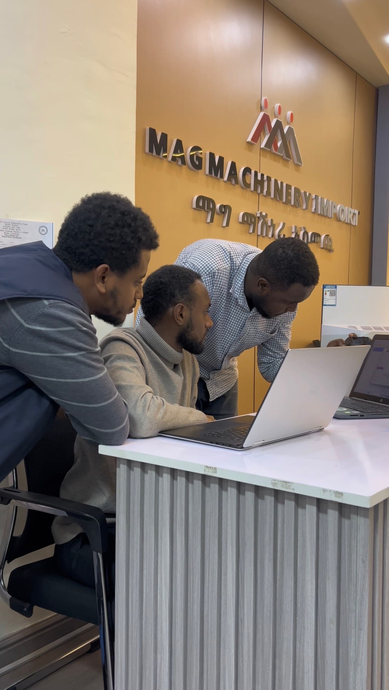 The Lucy team setting up a system at the Mag Machinery reception desk