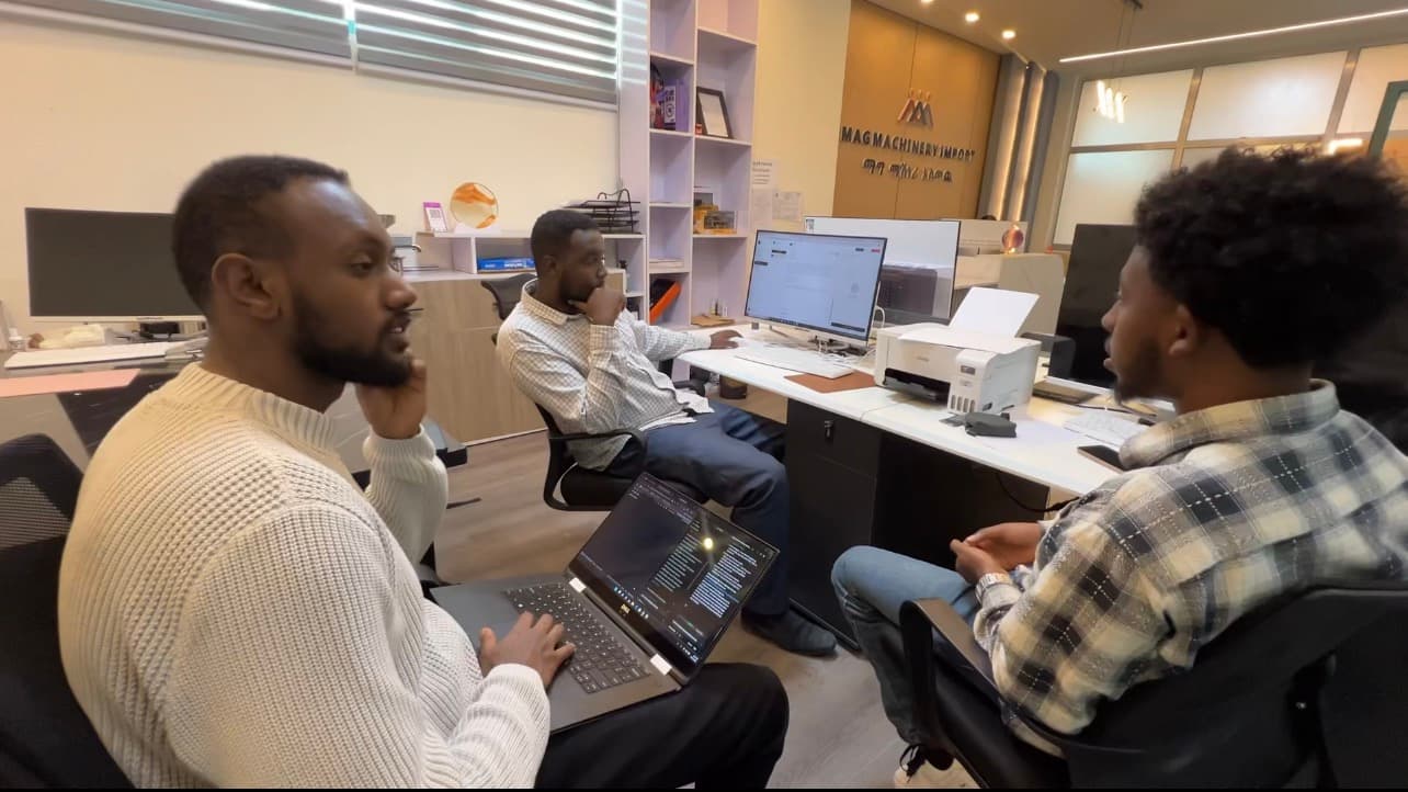 Team members discussing the setup at their desks
